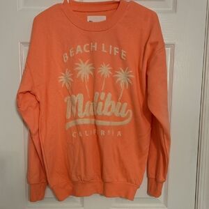 No Boundaries Coral-Orange Crewneck Sweater with Malibu Palm Graphic